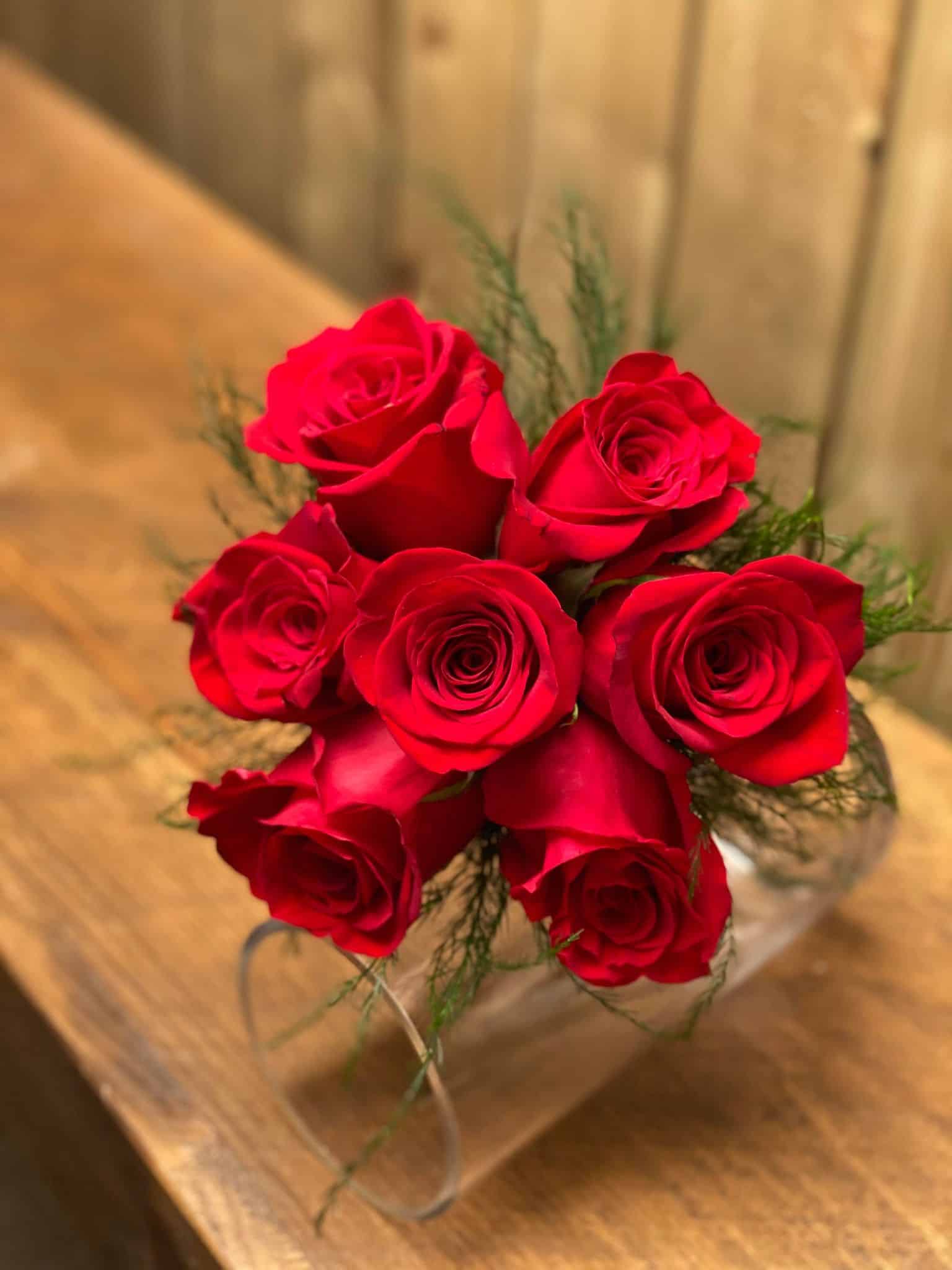 View from above of 7 red roses.