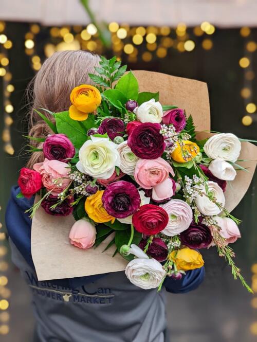 A bright and colourful all ranunculus bouquet.