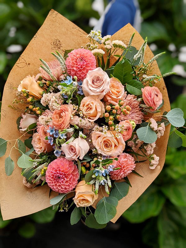A lush peach hand-tied bouquet.