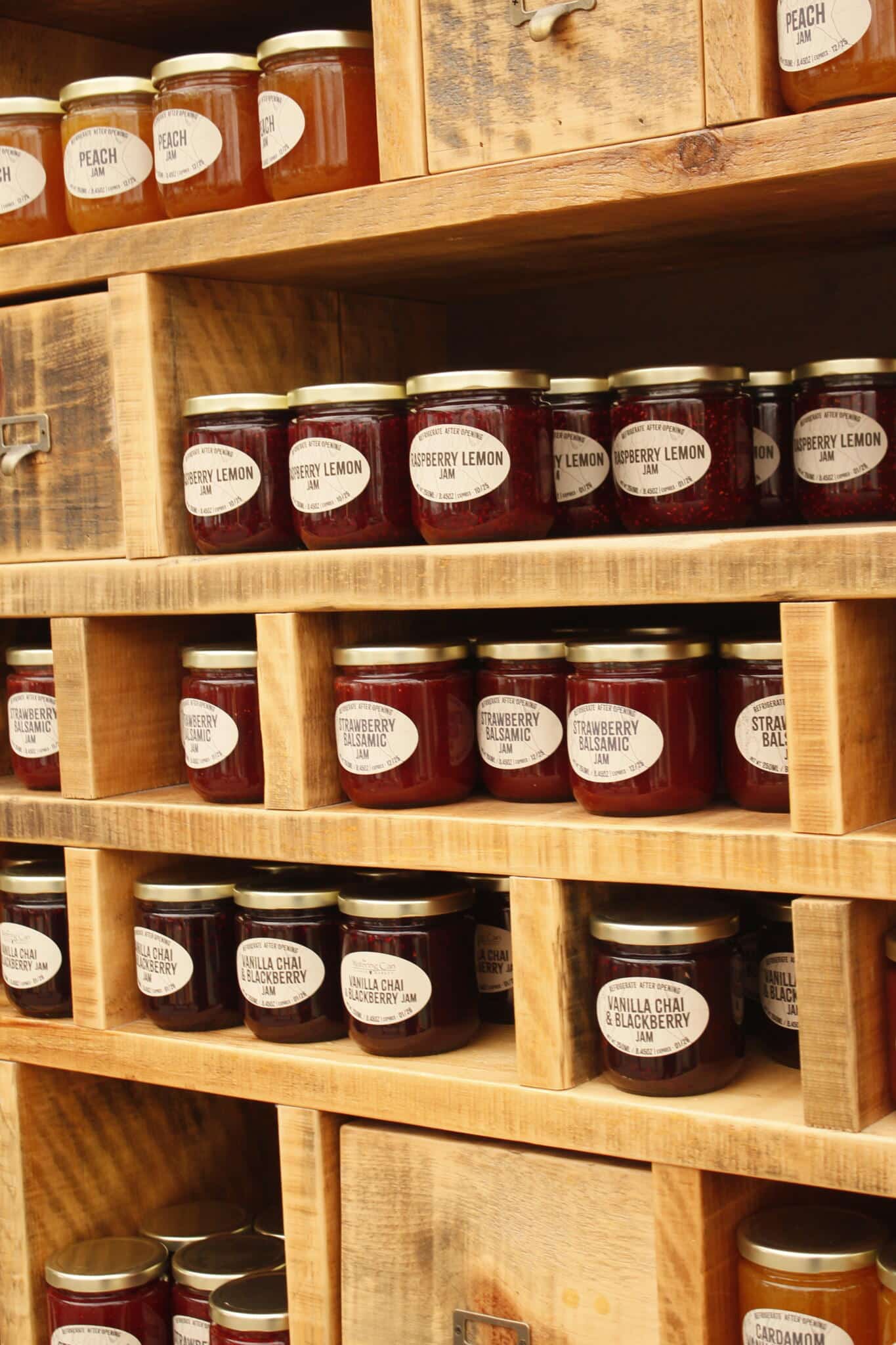 House-Made Preserves Display at The Watering Can Shelf display of house-made preserves and sauces available at The Watering Can Flower Market