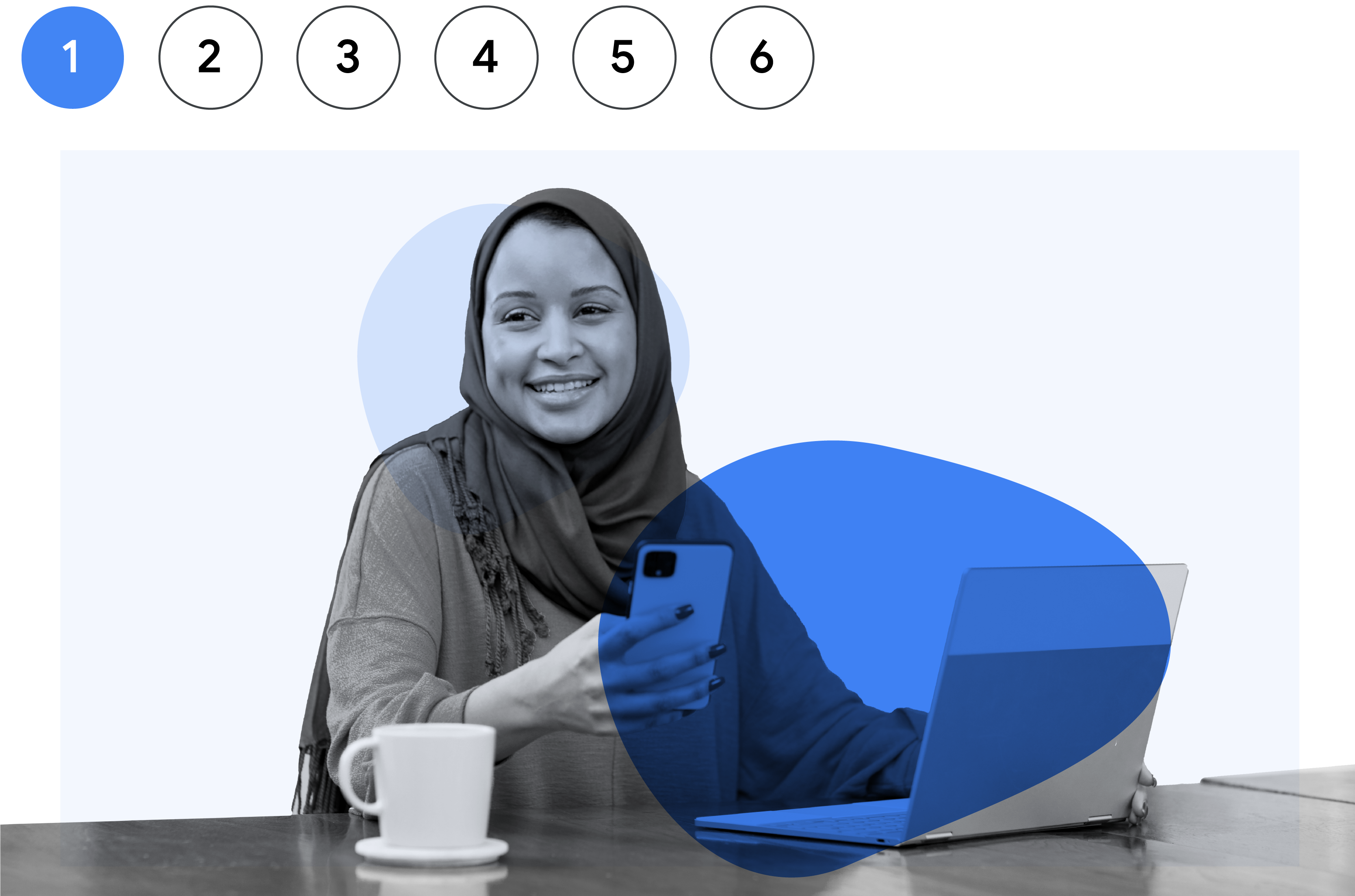 A woman of color wearing a hijab smiles as she holds her smartphone.