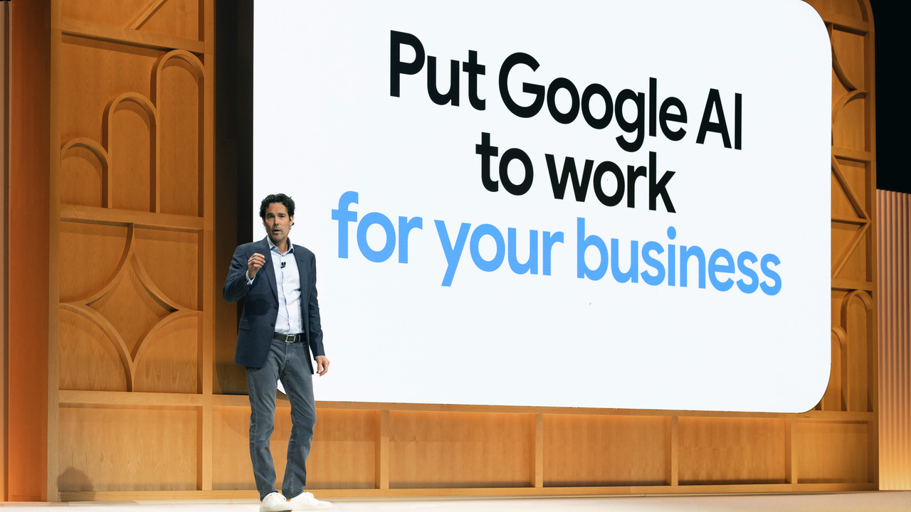 Philipp Schindler, SVP, chief business officer at Google, speaks in front of a large screen reading “Put Google AI to work for your business” on stage at Google Marketing Live, May 21, 2024.