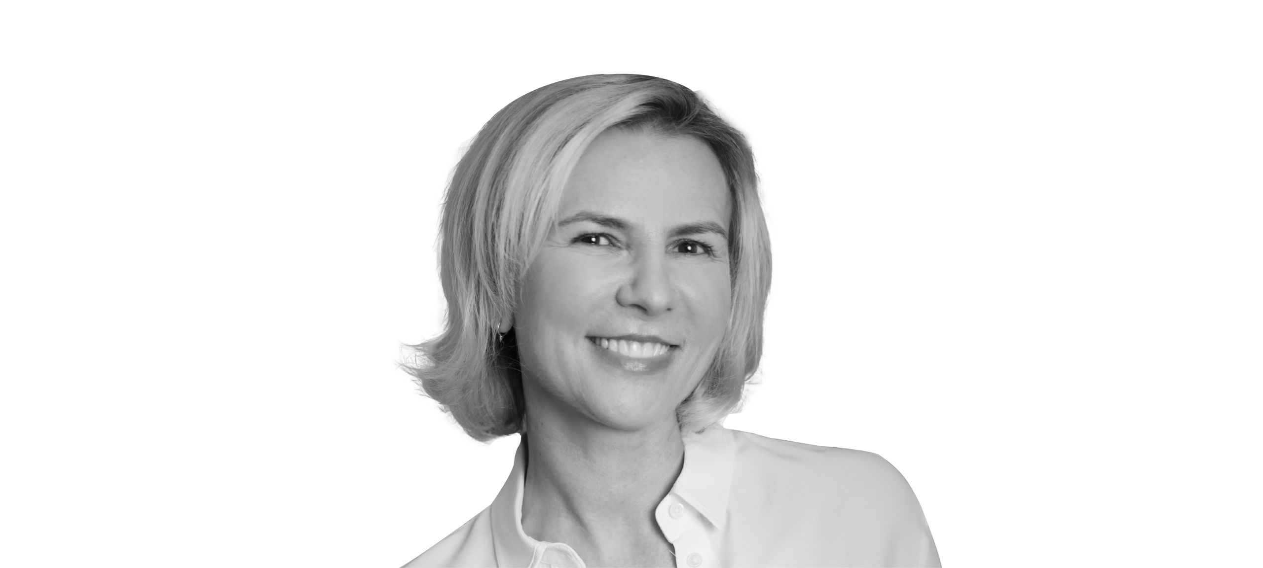 Aude Gandon, global CMO of Nestlé, is pictured from the shoulders up, wearing a white, collared shirt. She has light skin and short blond hair. She is smiling a bright smile and looking directly into the camera.