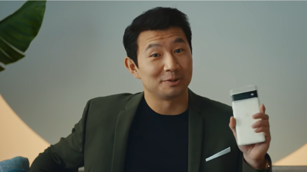 Marvel superhero, Simu Liu, holds the Google Pixel 6