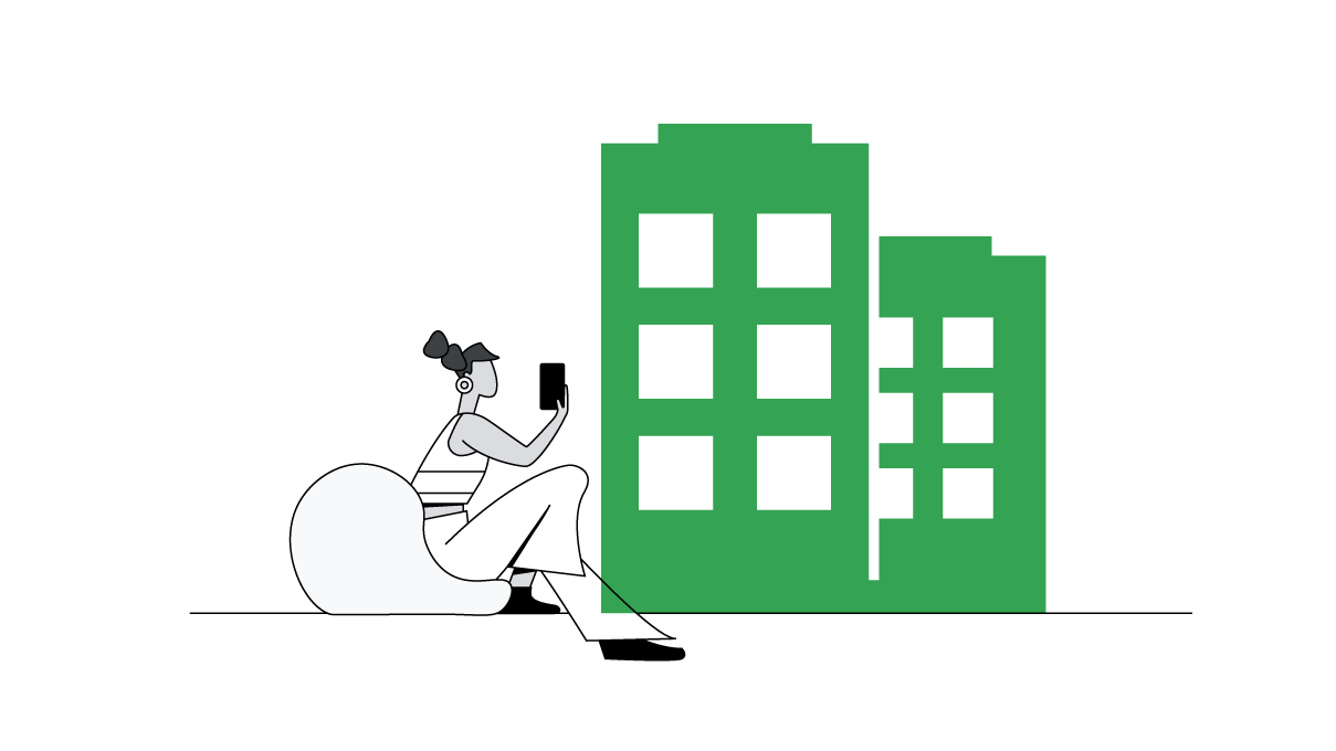 A woman with her hair tied up sits on a bean-bag, holding a mobile phone. To the right, two green buildings with white windows