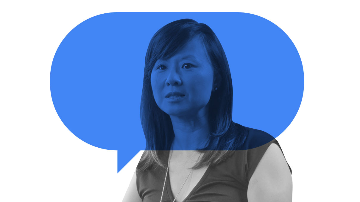Amy Yu, managing director & global partner of Labelium is pictured from the shoulders up. She is has light skin and shoulder-length black hair with bangs. She wears a dark V-neck dress with short sleeves.