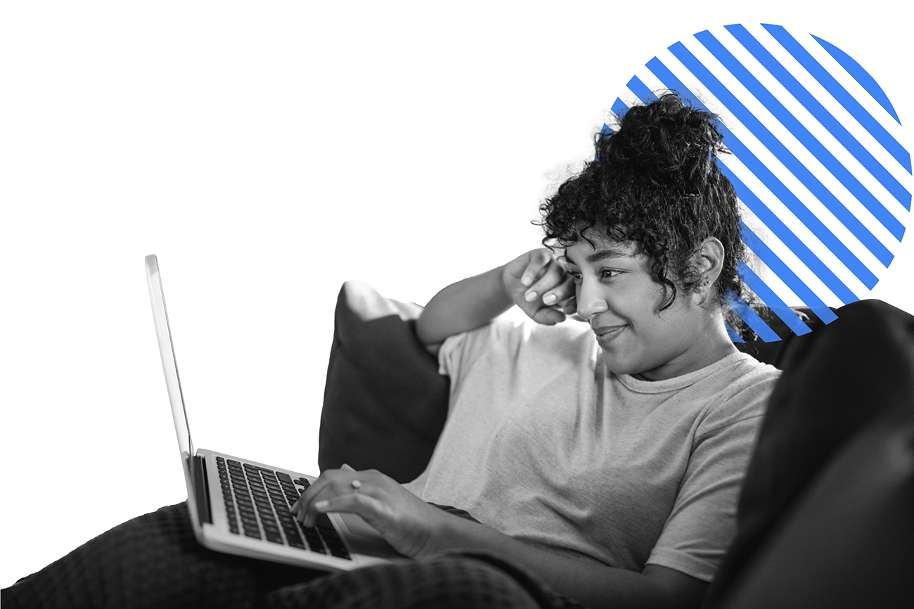 A photo of a person on a couch looking at a laptop. An illustration of a circle with diagonal lines is behind the person.