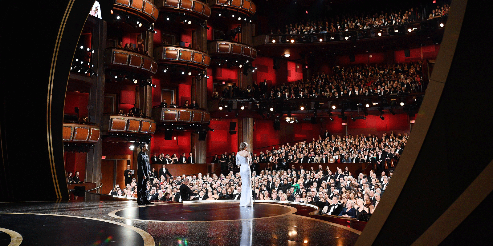 Actress Renée Zellweger stands in front of the audience at the Academy Awards and accepts the award for Best Actress.