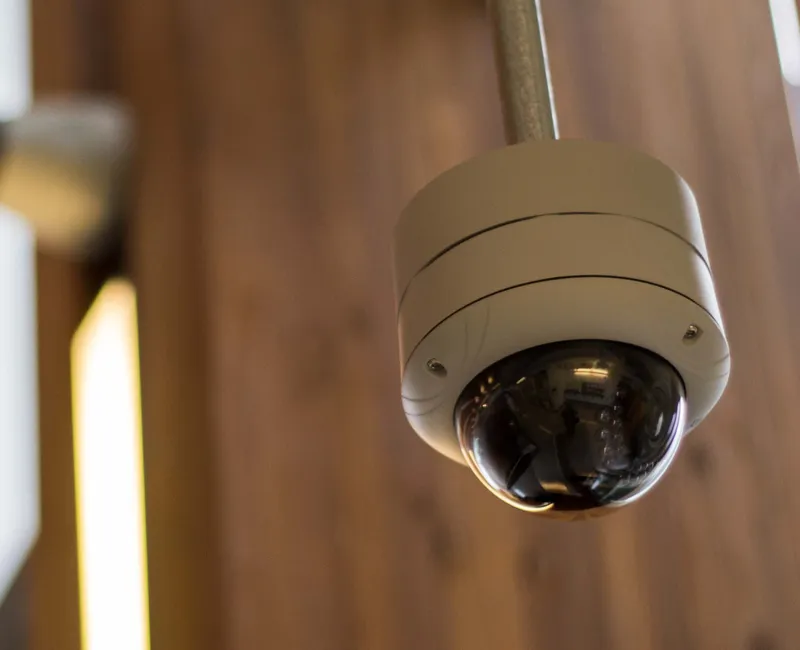 A security camera hangs in the AMS Student Nest.