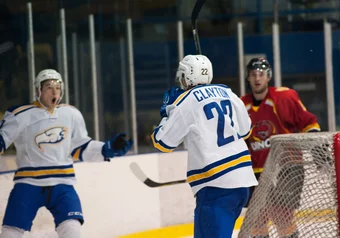 Bounassisi and Bardaro celebrate a winning goal.