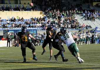 UBC Quarterback #15 makes a pass against Regina. Football