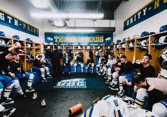 Winter Classic men's hockey team in the locker room