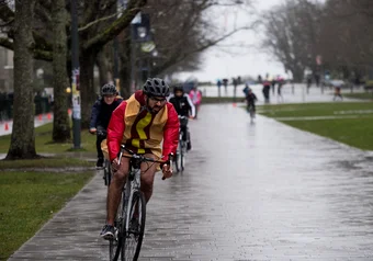 Zubair cycling in a hot dog costume during storm the wall/Biking while dressed as a sandwich