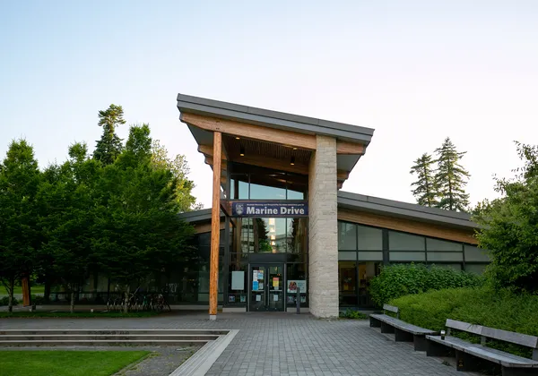 A photo of the front of Marine Drive with trees around the building.