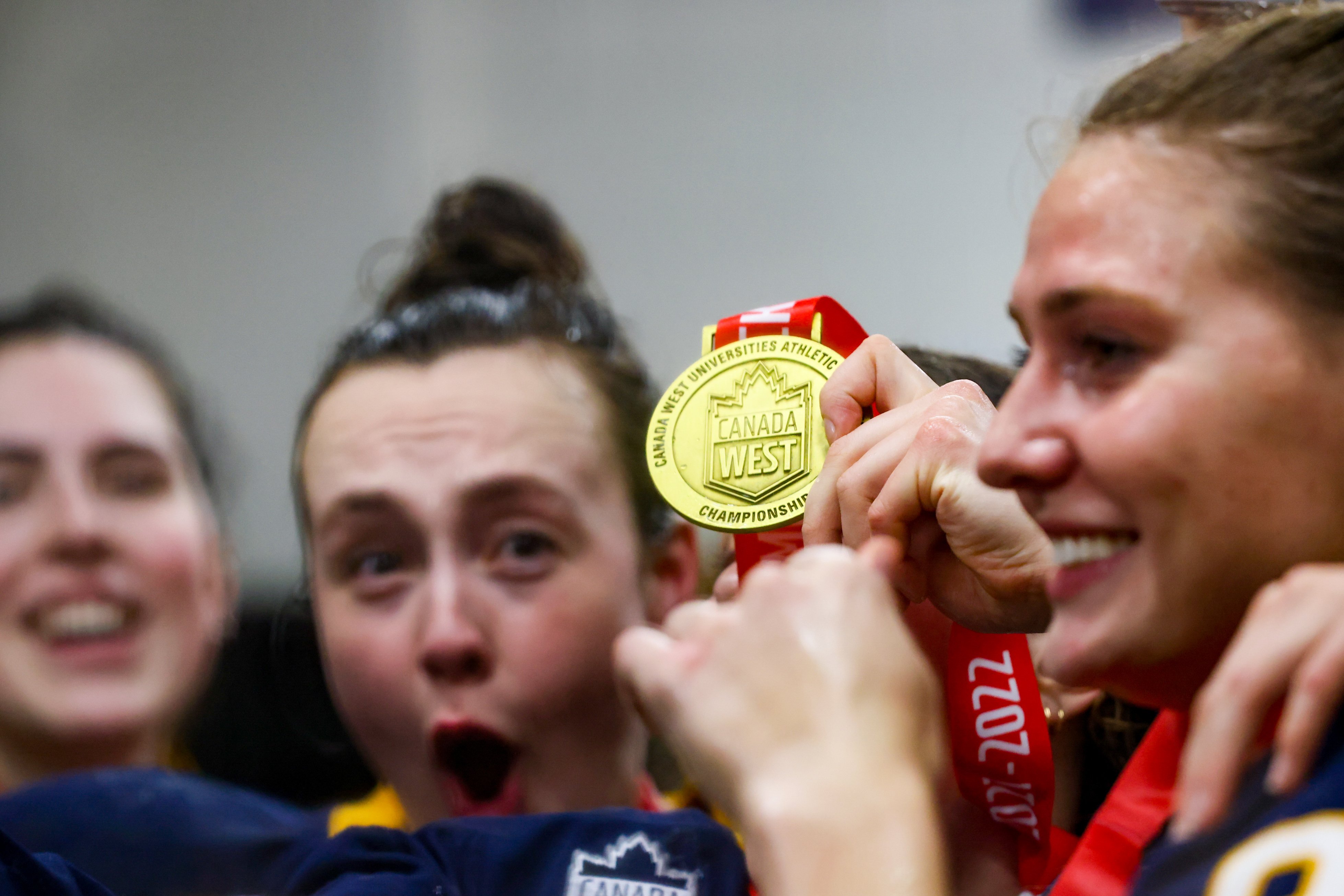 The T-Birds celebrates their success in their locker room.