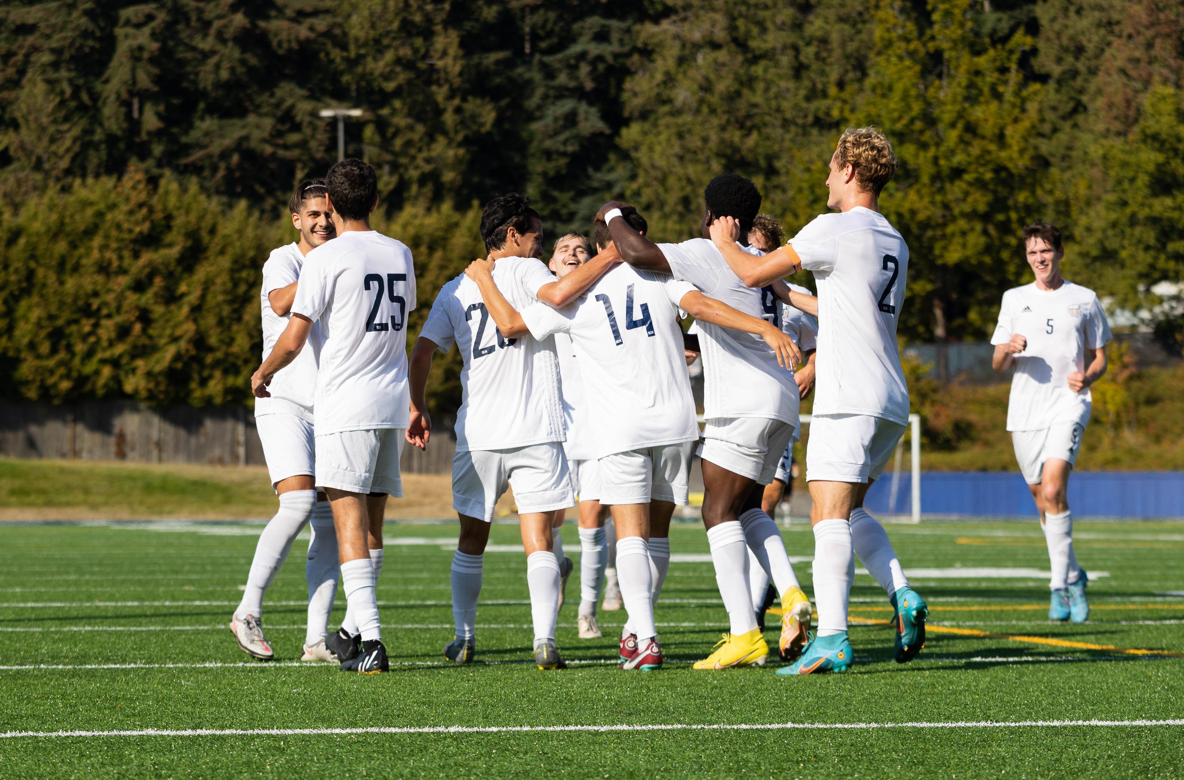 The Thunderbirds celebrate after Logan Chung's 40th minute goal.