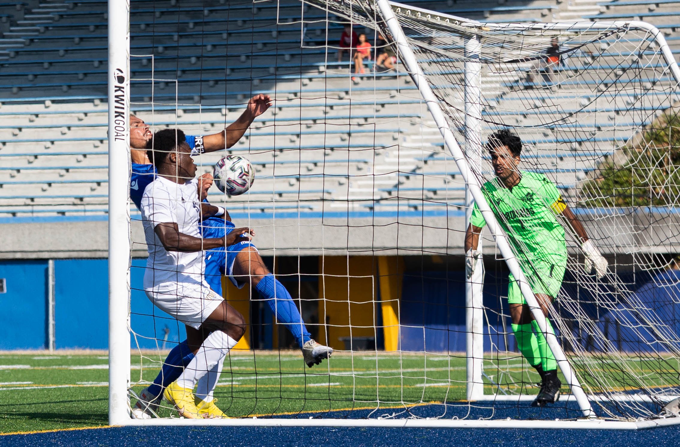 Fifth-year forward Victory Shumbusho chases the ball after keeper Nijjar's attempted save.