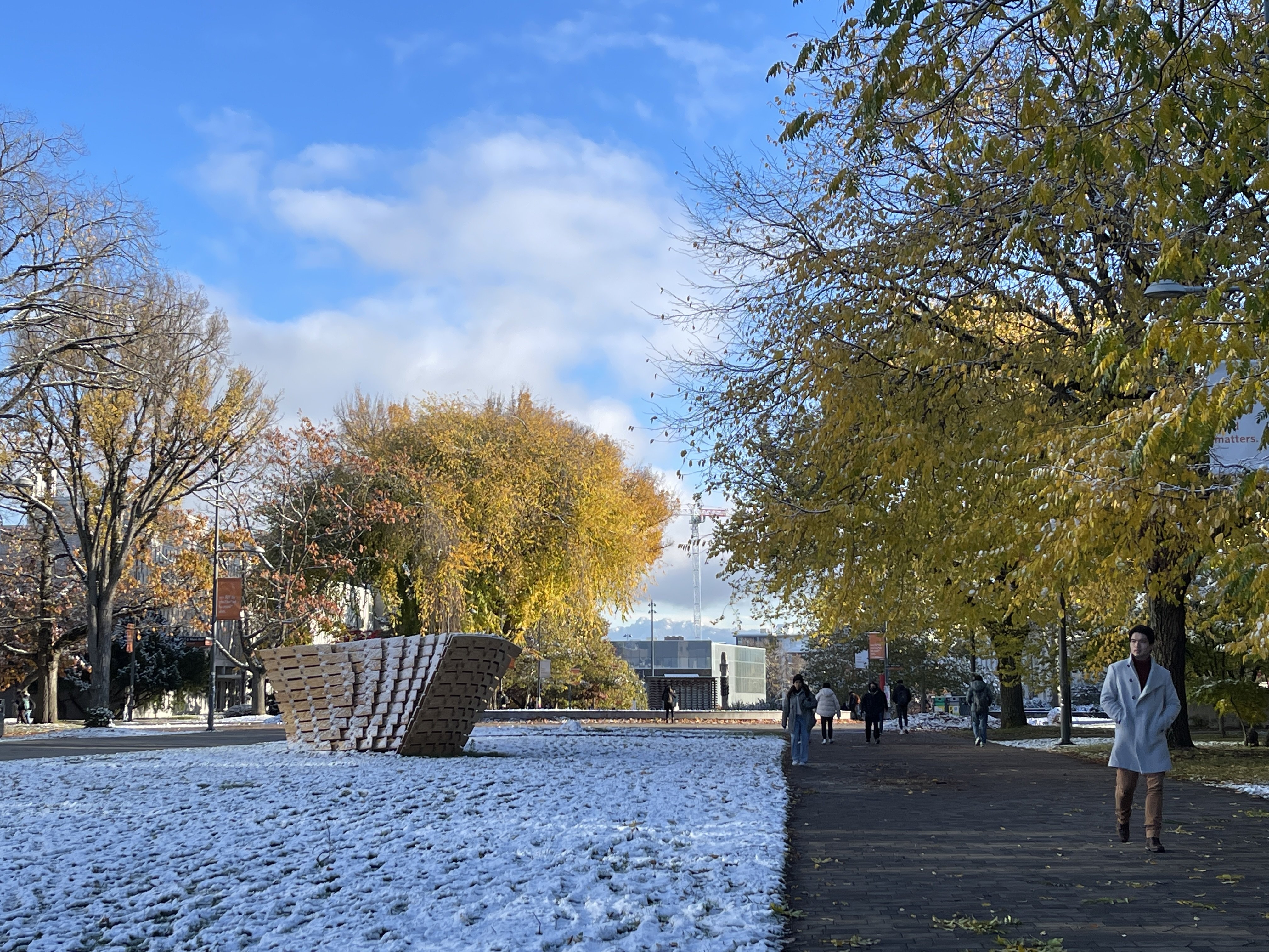 The University Blvd hill provides a glimpse of the snow-capped mountains.