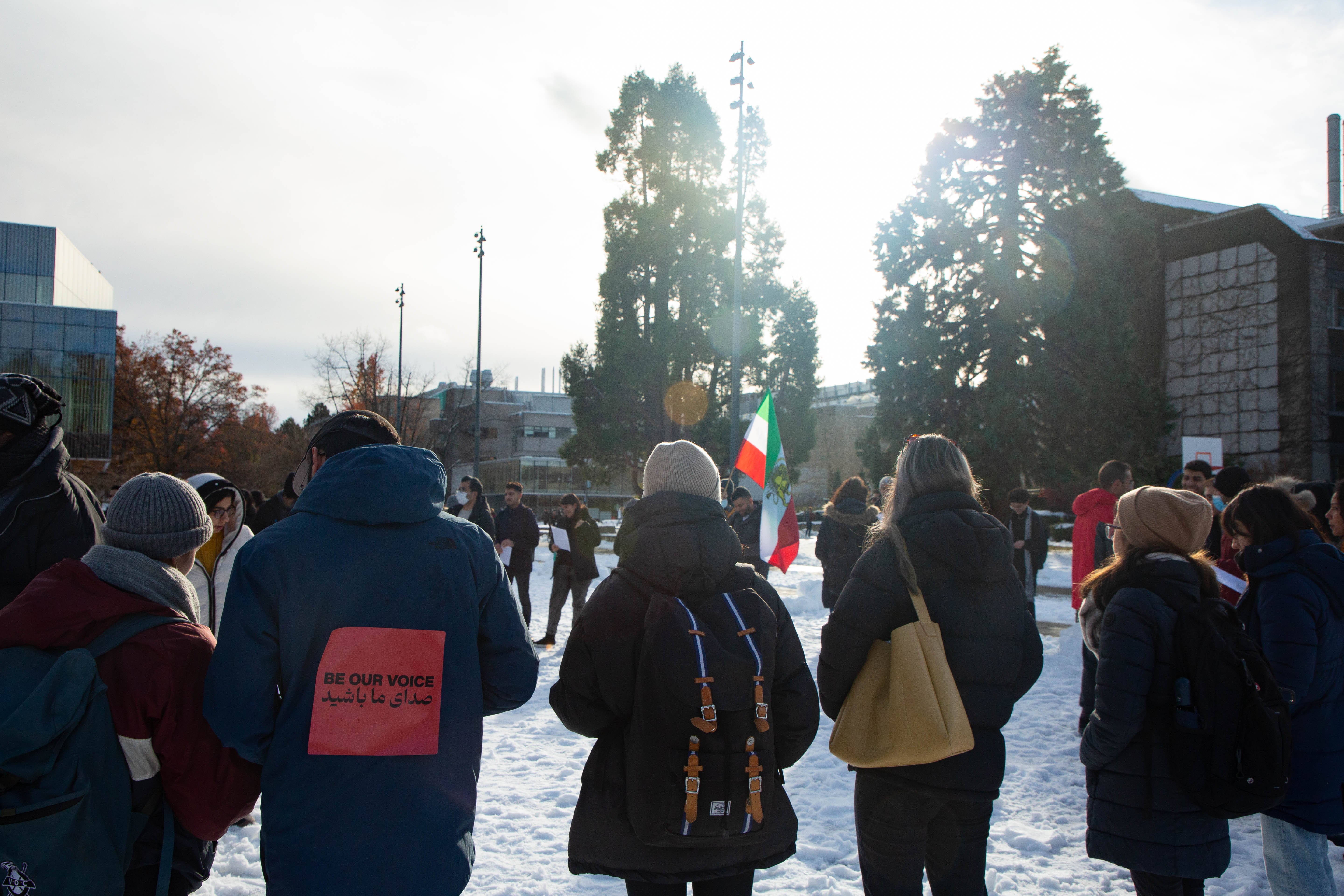 Attendees gathered in concentric circles outside the Nest and united in song.