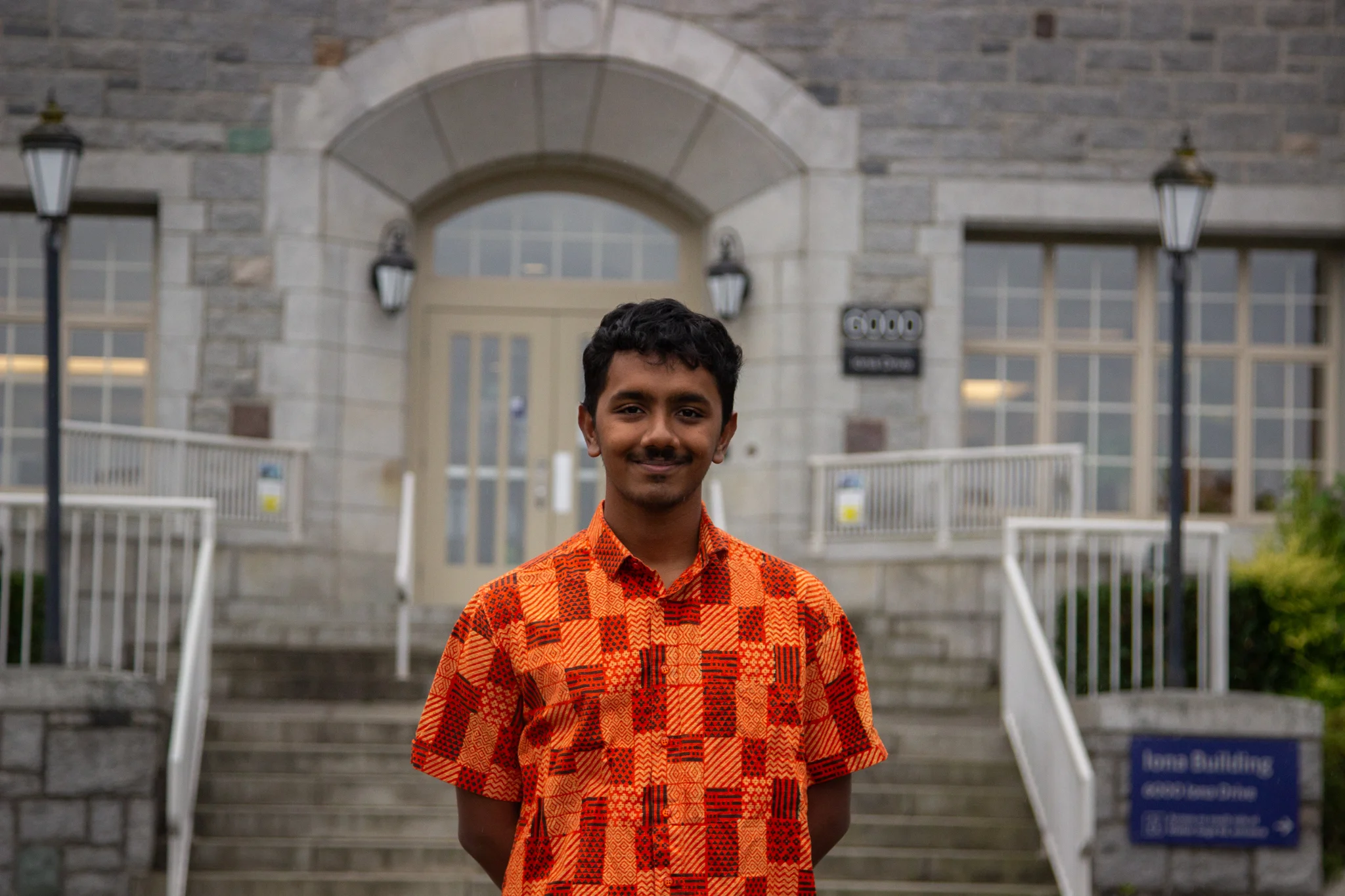 Bashar in front of the Iona building.