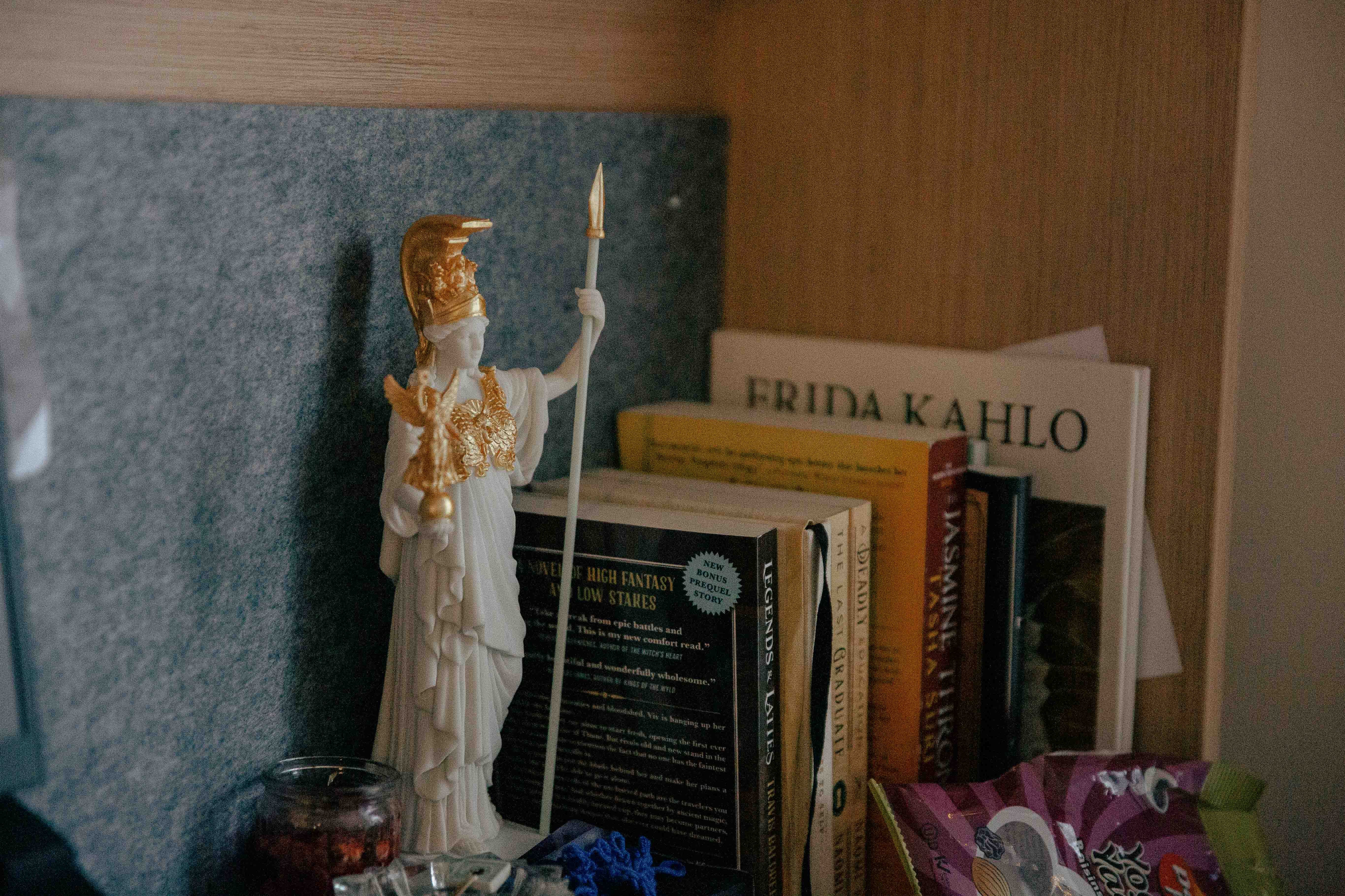A statue of Athena on Tan's desk motivates him to study.