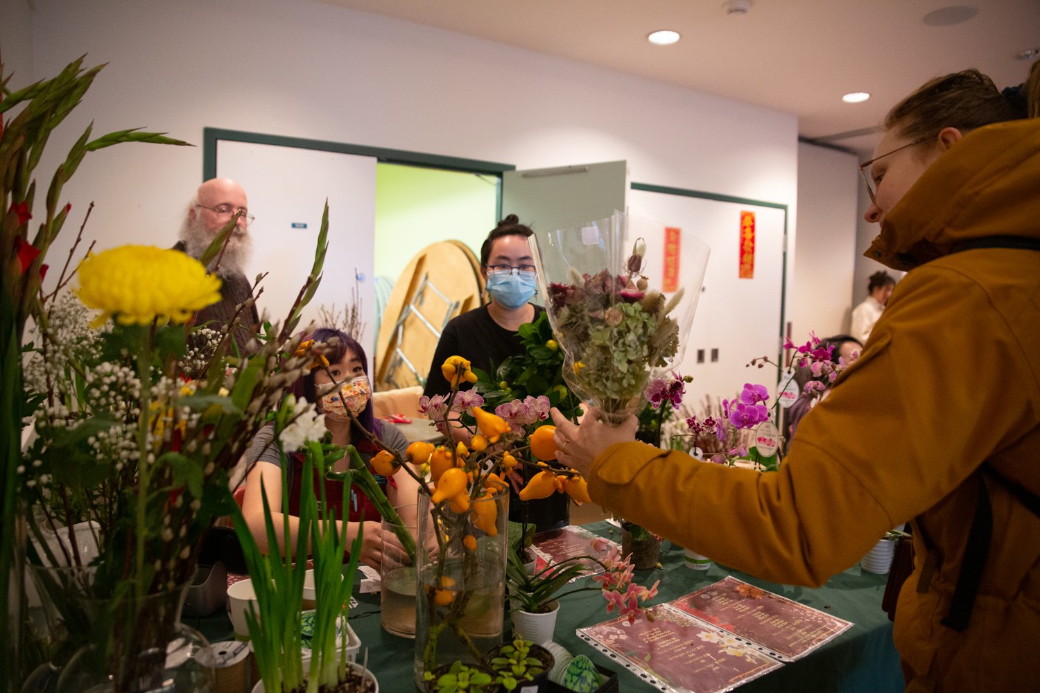 Yu and other garden employees hand out plants to market attendees. The market had an even further reach than Yu originally anticipated, reaching beyond campus and into the wider Vancouver community.