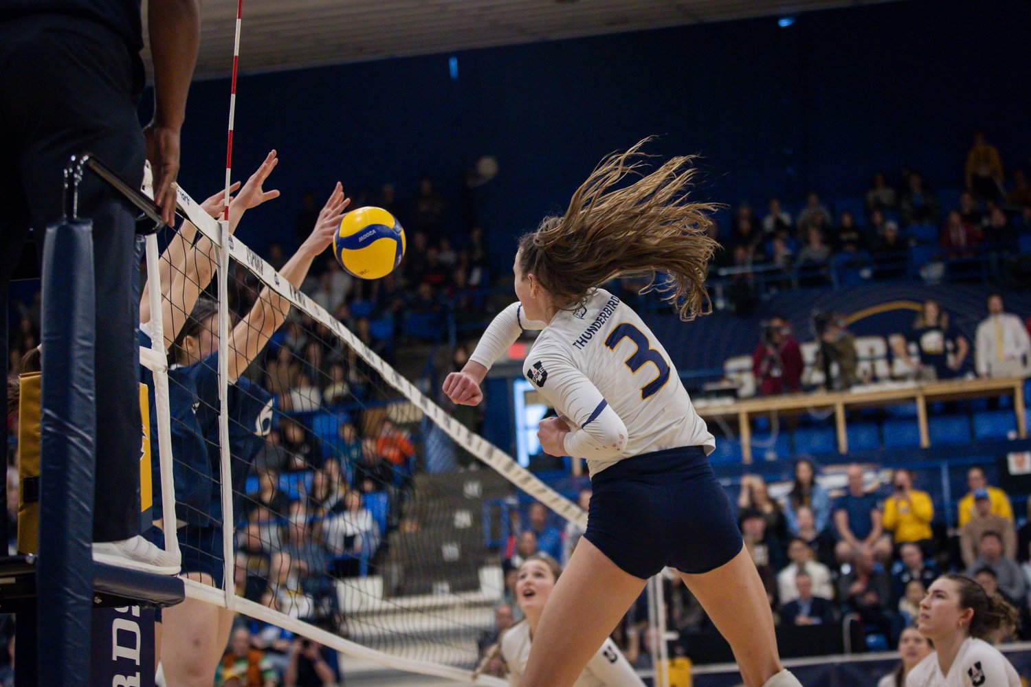 Elise Petit swings cross-court.