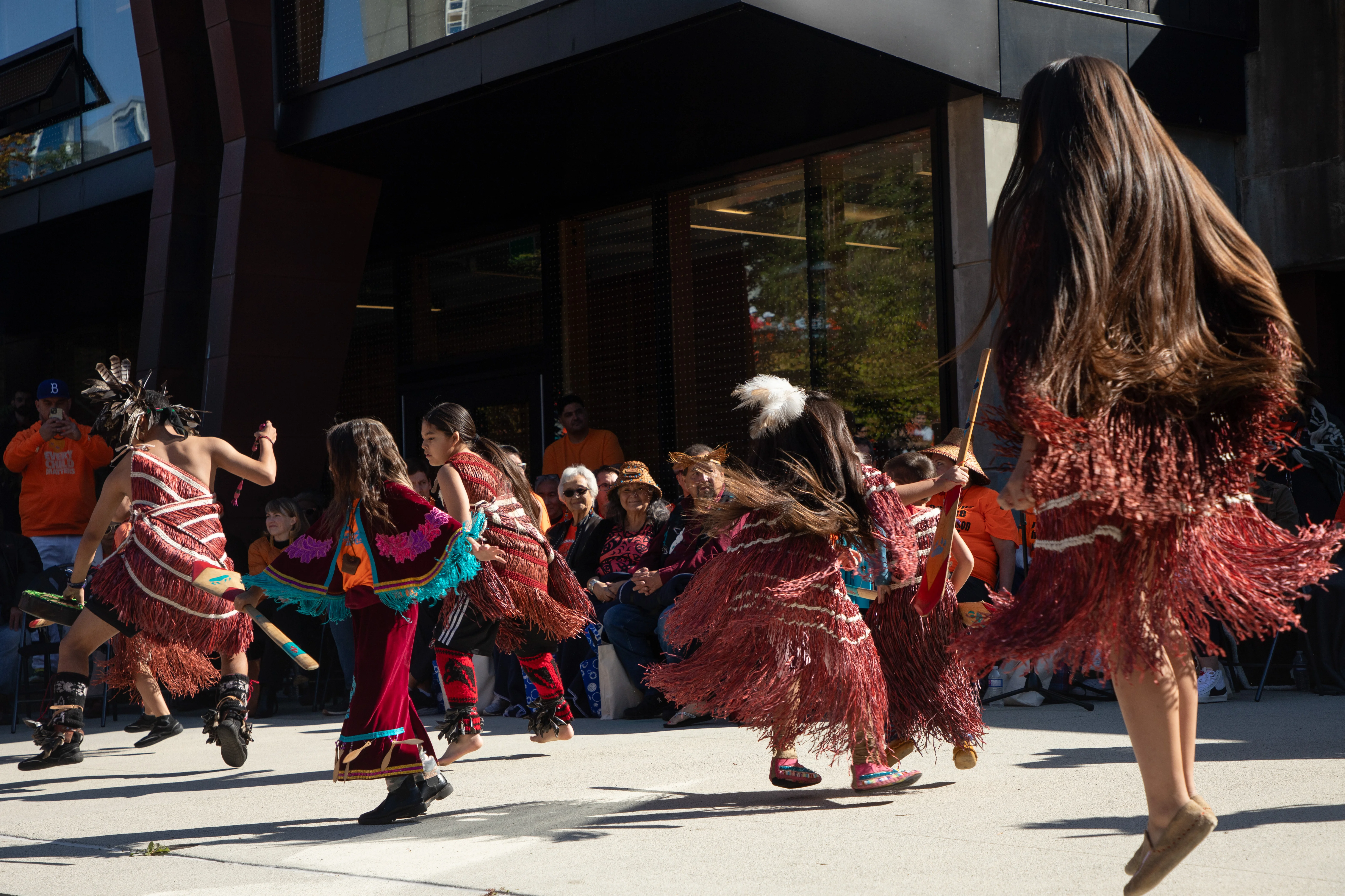 Tsatsu Stalqayu (Coastal Wolfpack), a traditional Coast Salish song and dance group, performs before the marchers.