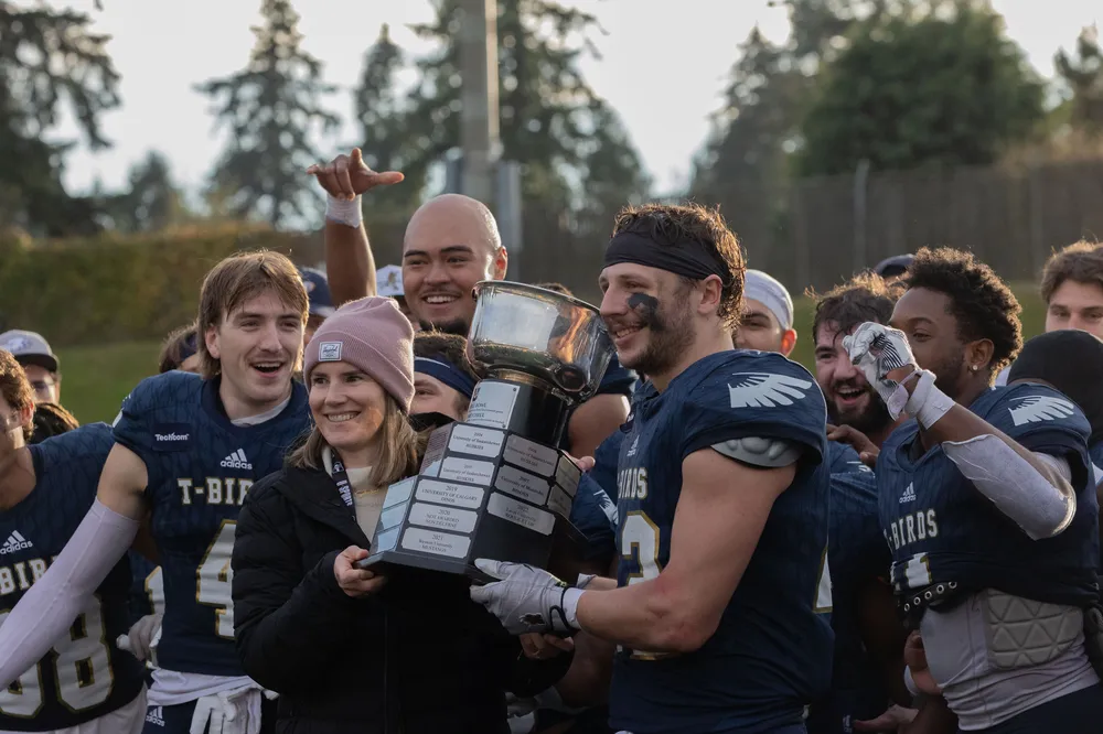 UBC lifts the Mitchell Bowl after beating STFX by a large margin.