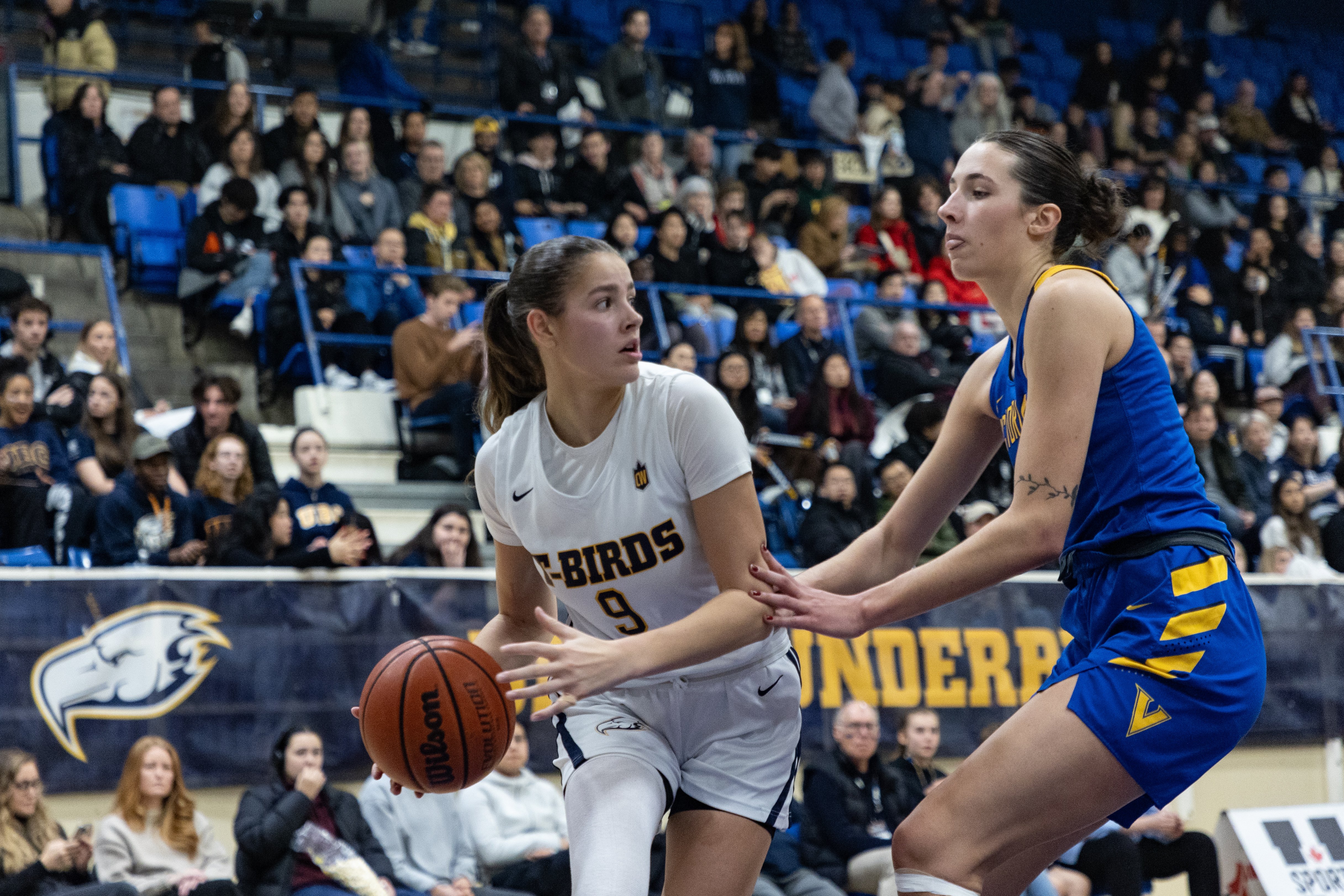 Olivia Weekes looks to pass the ball.