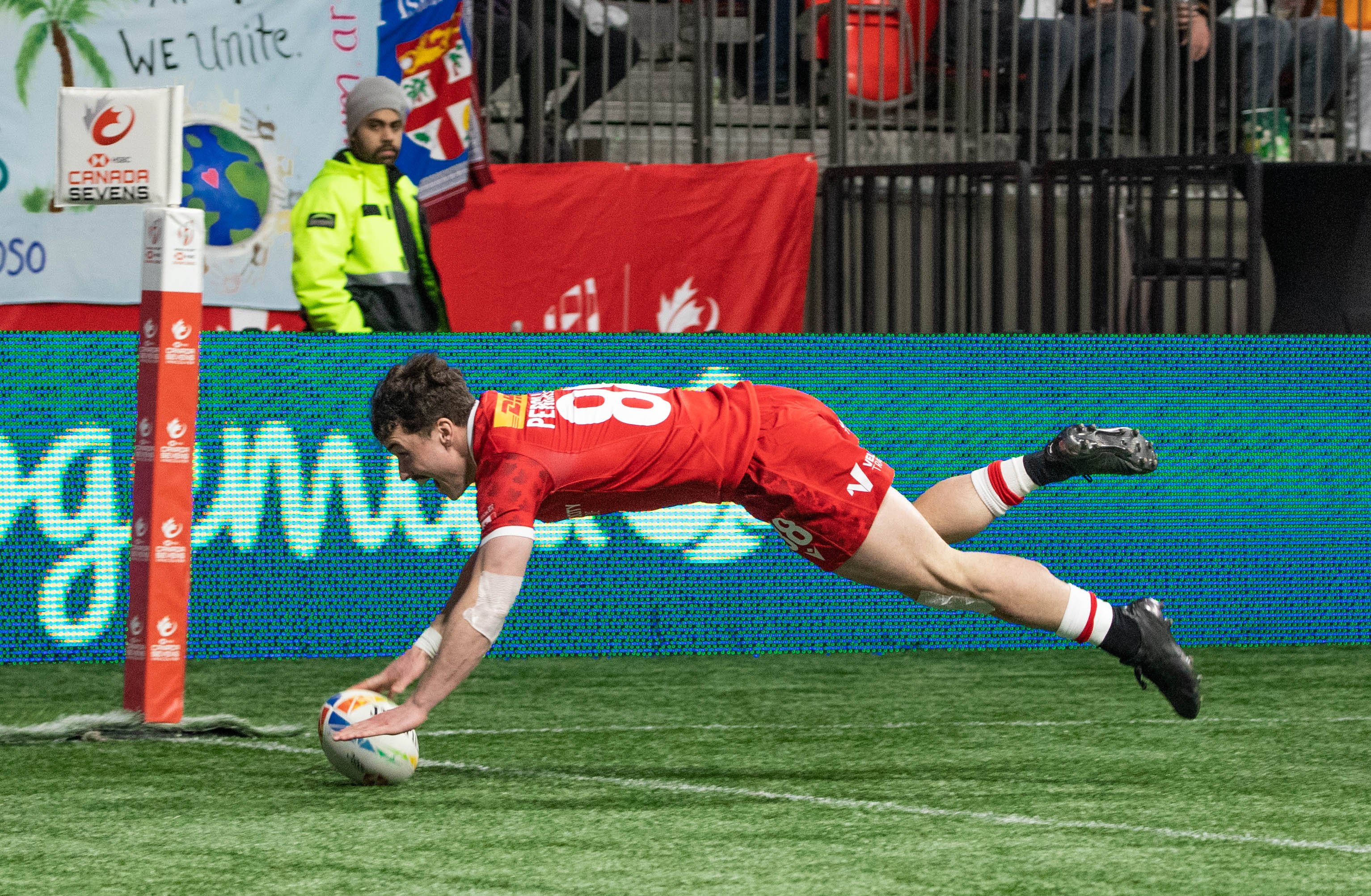 Percillier dives into the try zone to score his third try of the tournament.