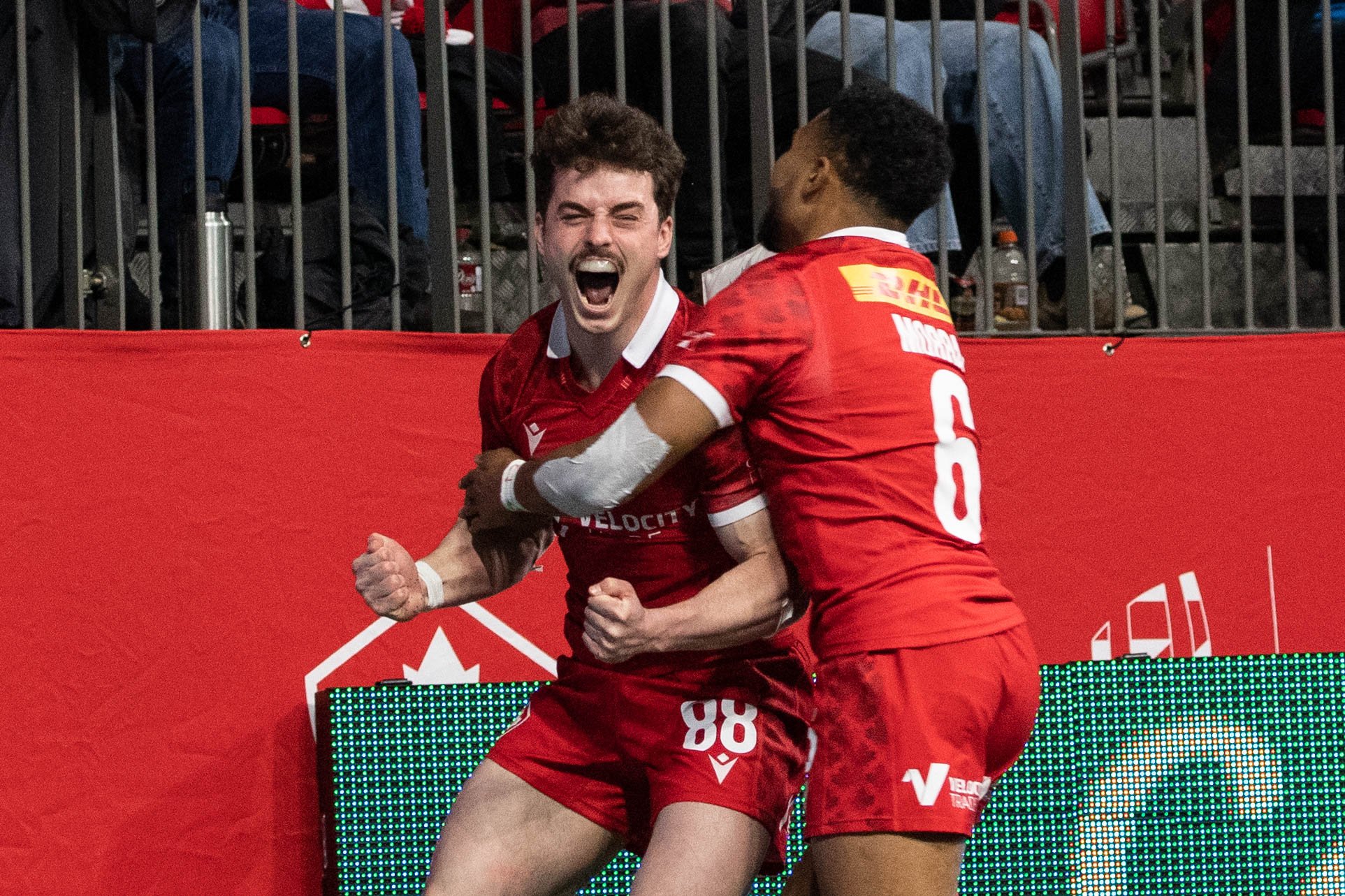 Percillier (#88) celebrates his first diving try in Canada's second-day battle against Chile.