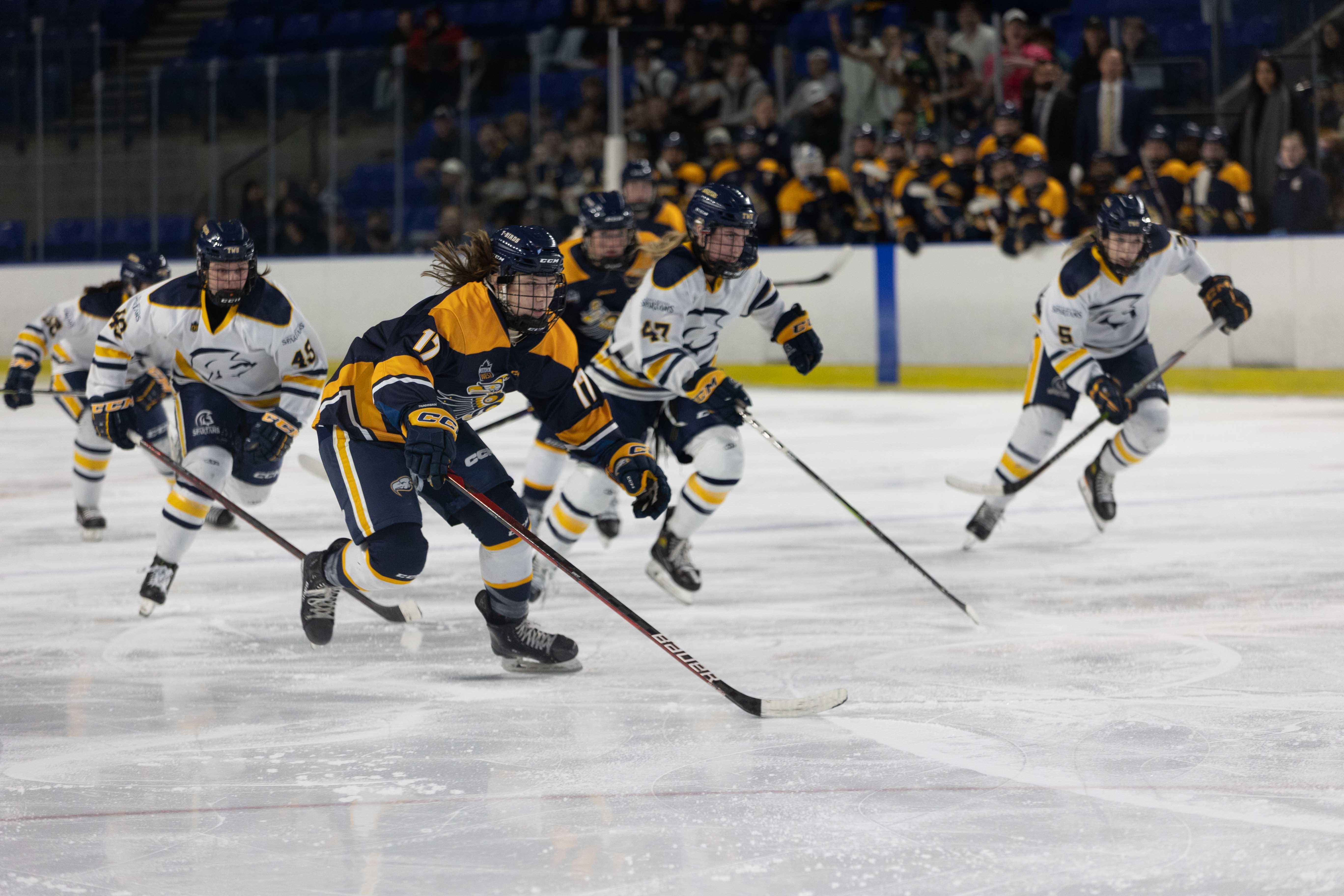 Madisyn Wiebe races for the puck.