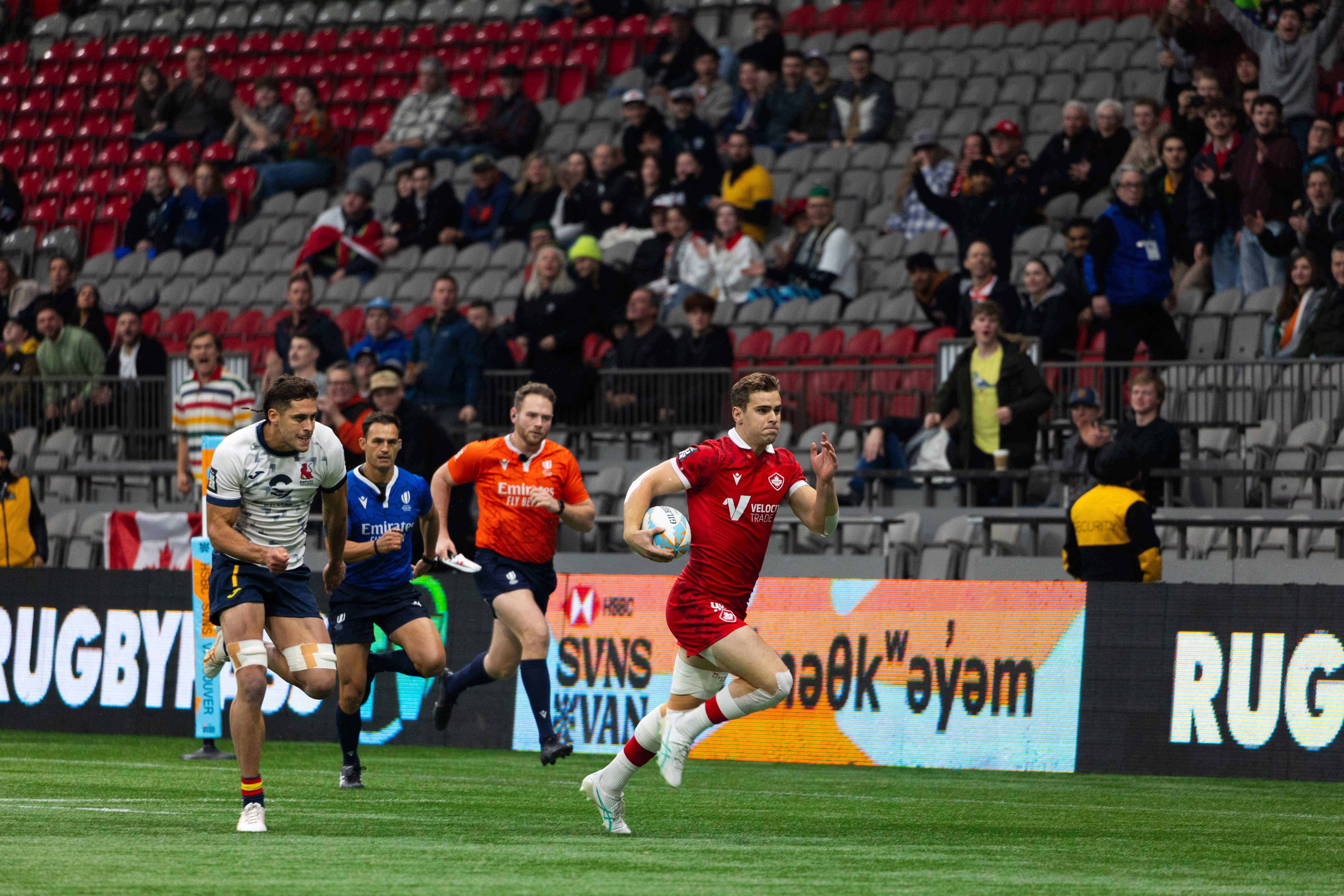 Carson runs for a try against Spain.