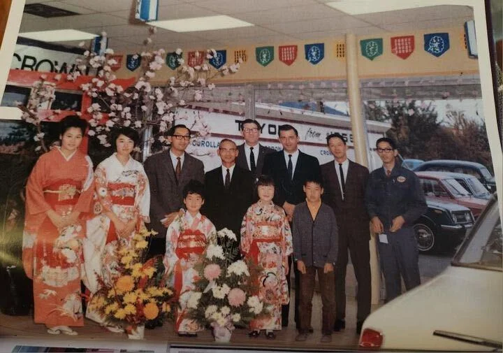 Chong's family pictured in traditional Japanese kimonos inside of their Toyota dealership.