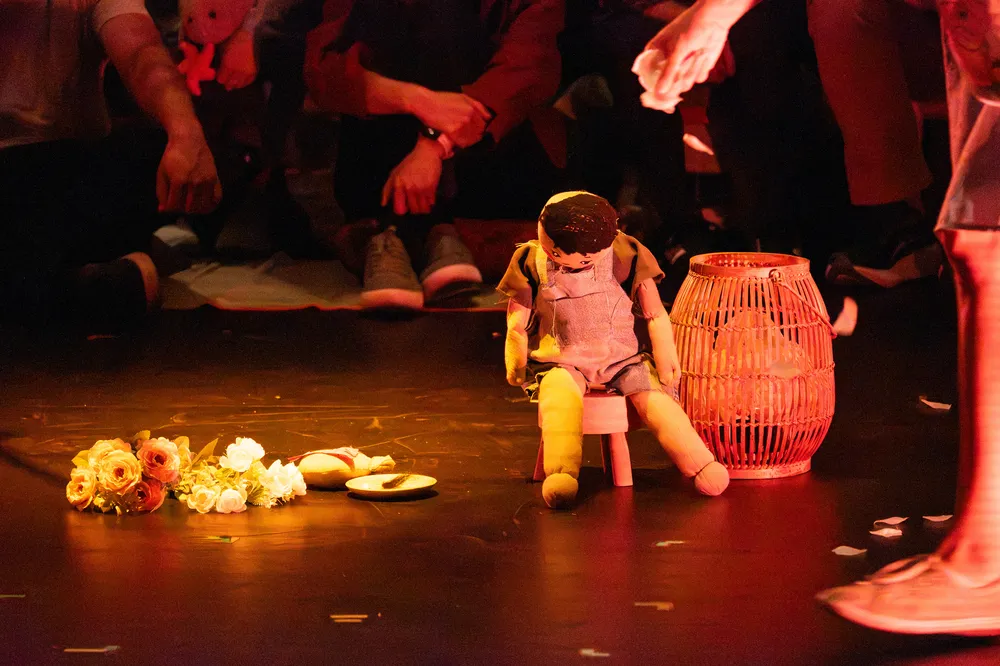 A doll sitting on a stage