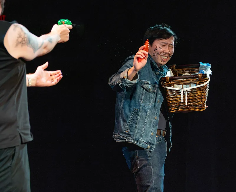 An Te Chu being shot at with a water gun