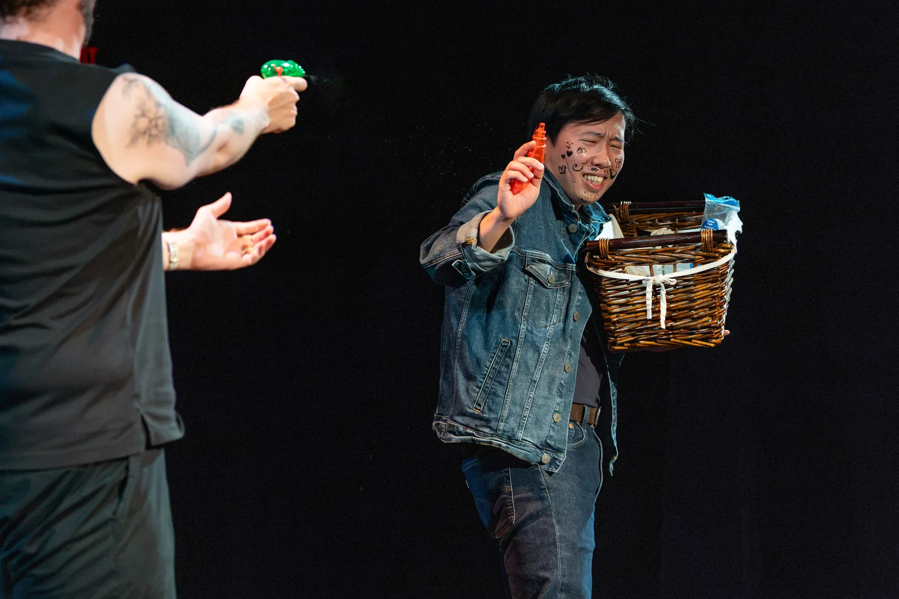 An Te Chu being shot at with a water gun