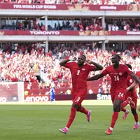 Canada's Cyle Larin (9) celebrates after scoring his side's first goal of the game with Promise David (24) during the second half of the World Cup Group B soccer match between Canada and Bosnia, Friday, June 12, 2026, in Toronto.
