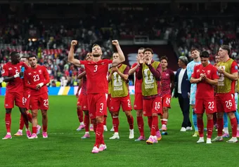 The Swiss national team celebrates their victory at BC Place.