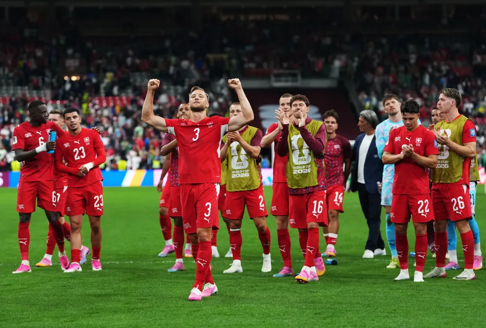The Swiss national team celebrates their victory at BC Place.