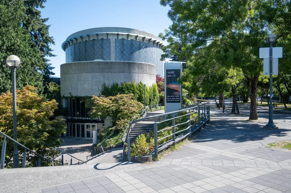 The circular Chan Centre building as seen from the Rose Garden.