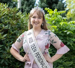 Shaelyn Hunter standing in pageant regalia