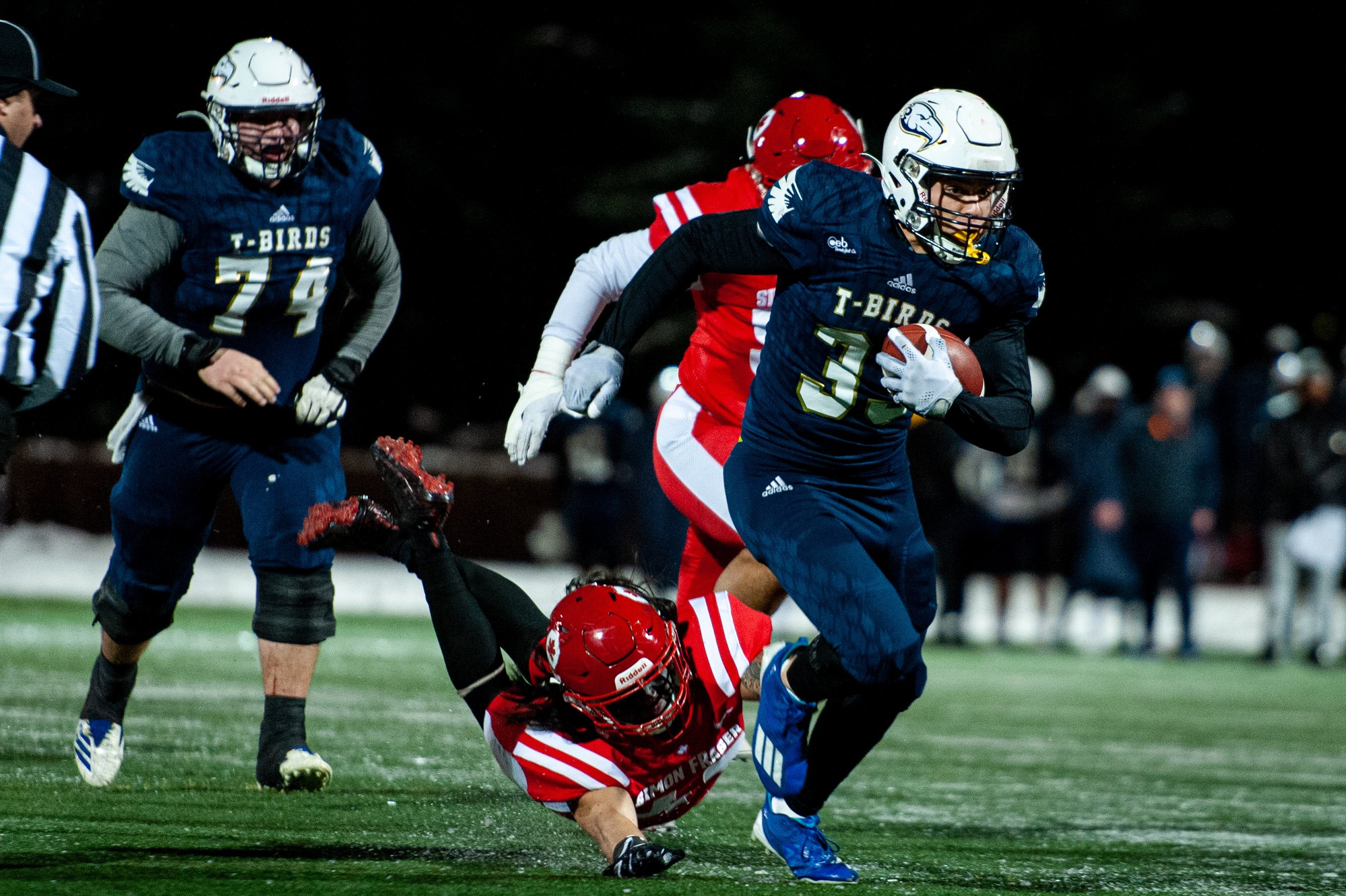 UBC running back Dane Kapler (#33) runs the ball.