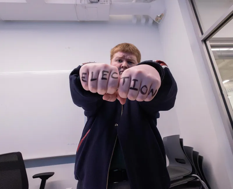 The article author with "ELECTION" written across their knuckles.