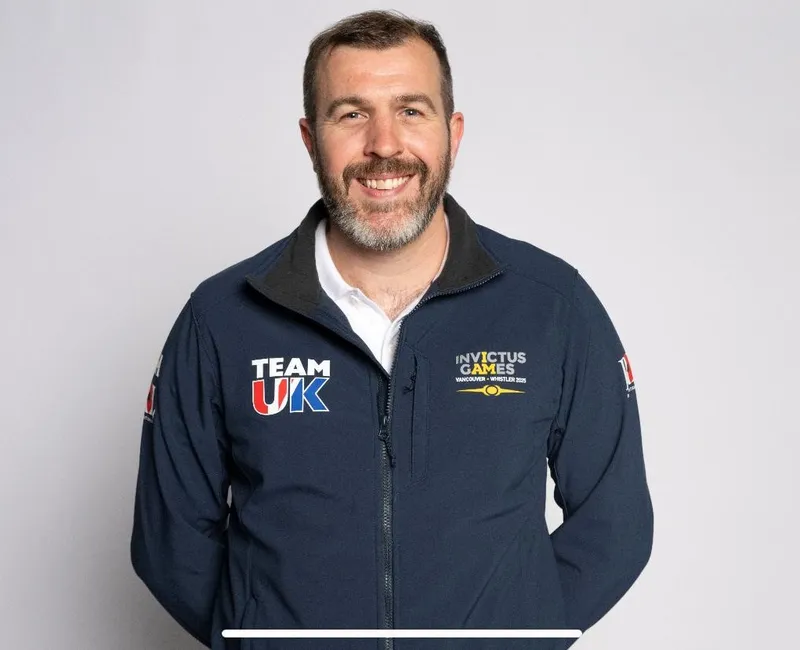 A headshot of Steve Irwin wearing a Team UK Invictus Games jacket on a white-grey background.