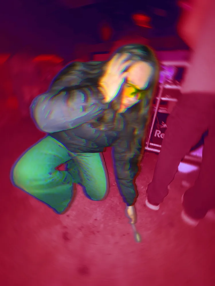 A poorly edited photo of a student digging to the bottom of the Pit using a wooden spoon.