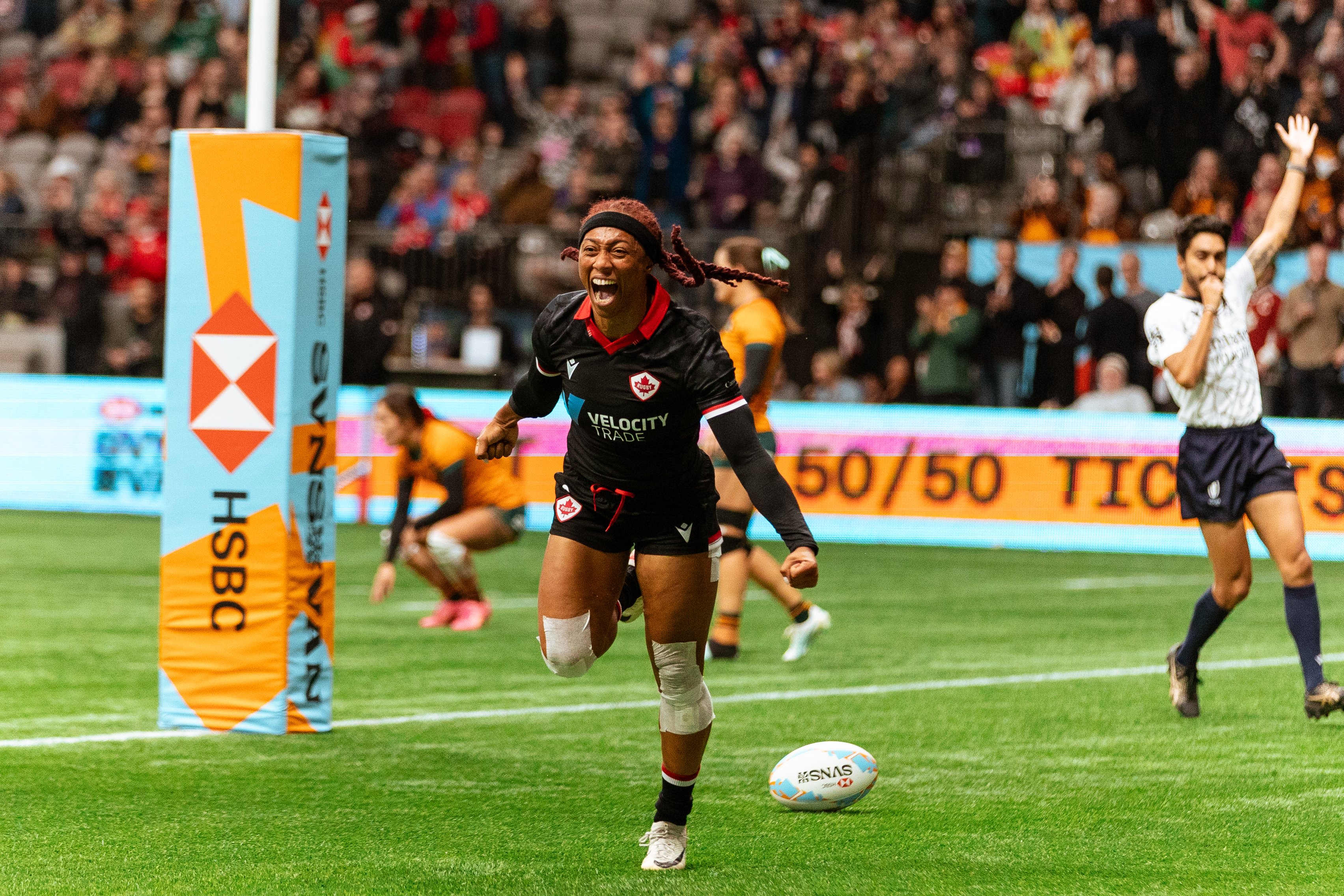 Charity Williams celebrates her try against Australia.