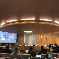 Wide eye view of Michael Kingsmill Forum, where AMS Councillors are sitting with their backs to the camera. VP Finance Gagan Parmar, President Riley Huntley, VP Admin Dylan Evans and VP Student Life Kevin Heieis are the only executives present.