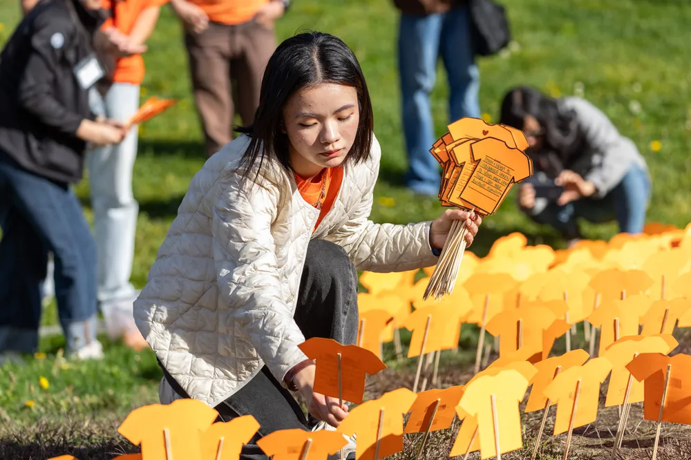 After the march, the printouts were planted across the Thunderbird Commons Field.